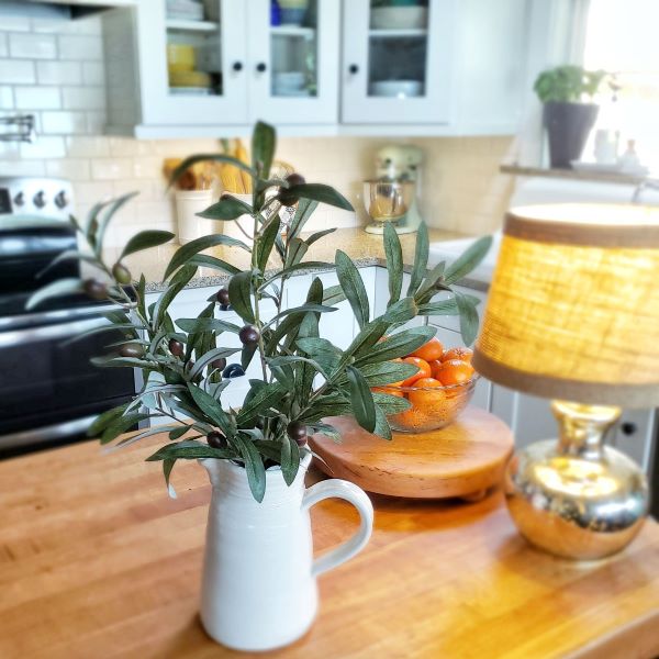 faux olive branched in kitchen