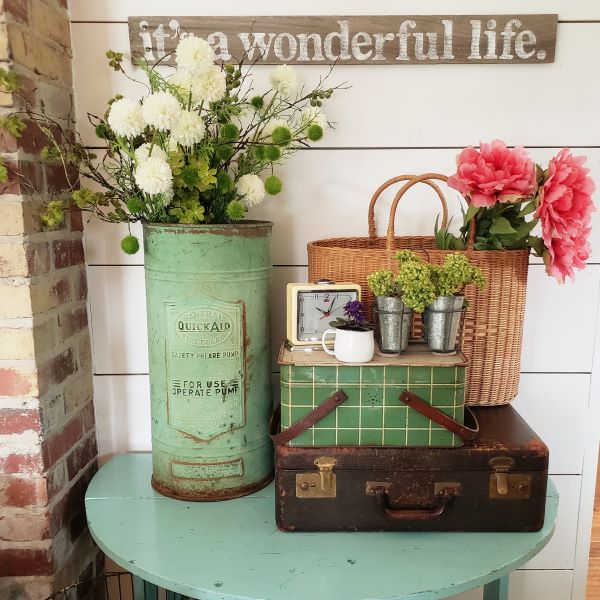 faux flowers and green vintage container and picnic basket