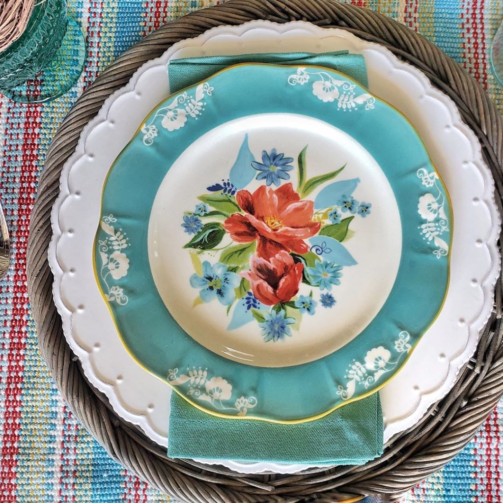 My Easter spring tablescape place setting, complete with floral plates from Pioneer Woman.