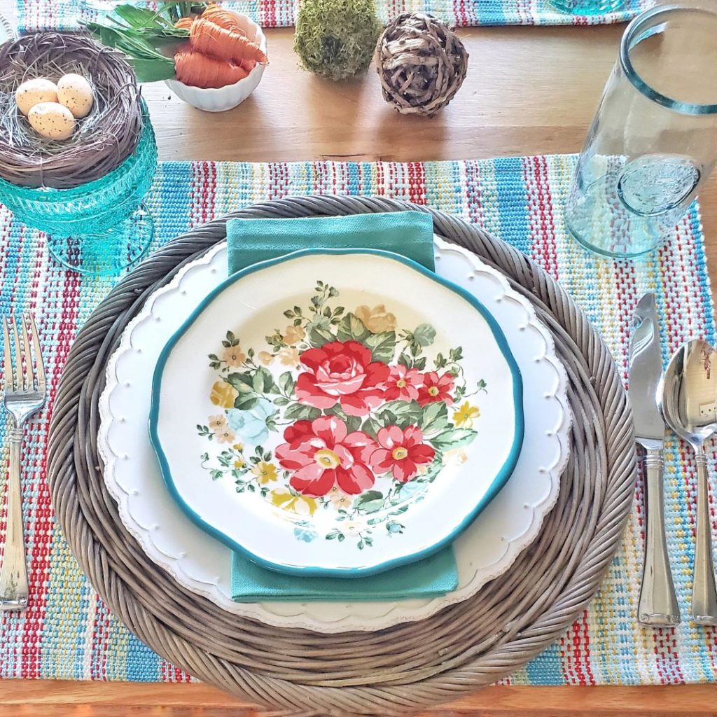 My Easter spring tablescape place setting, complete with floral plates from Pioneer Woman.