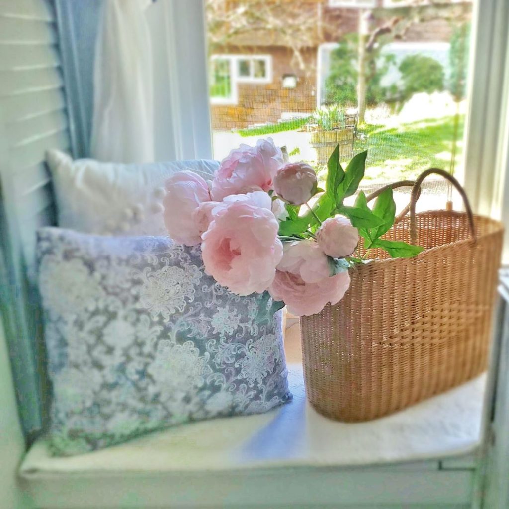 Faux peonies in a basket make the perfect spring look.