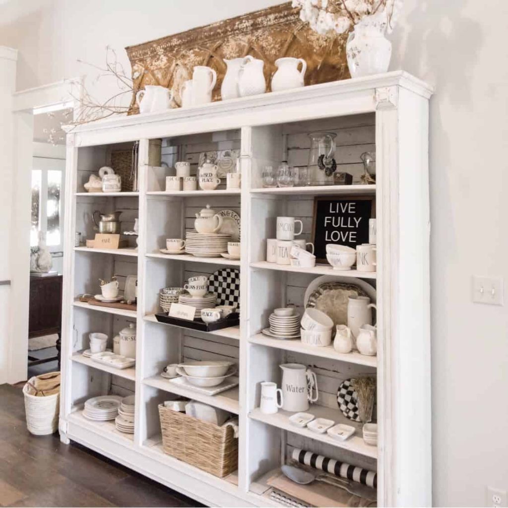 cabinet with open shelving and dishware