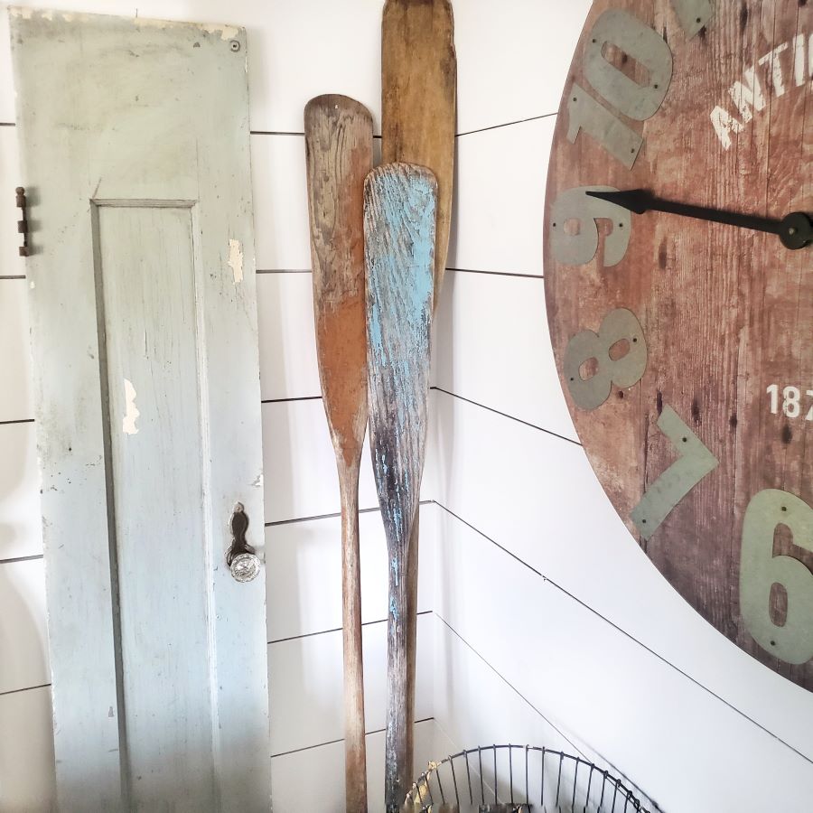 Vintage oars in corner of living room