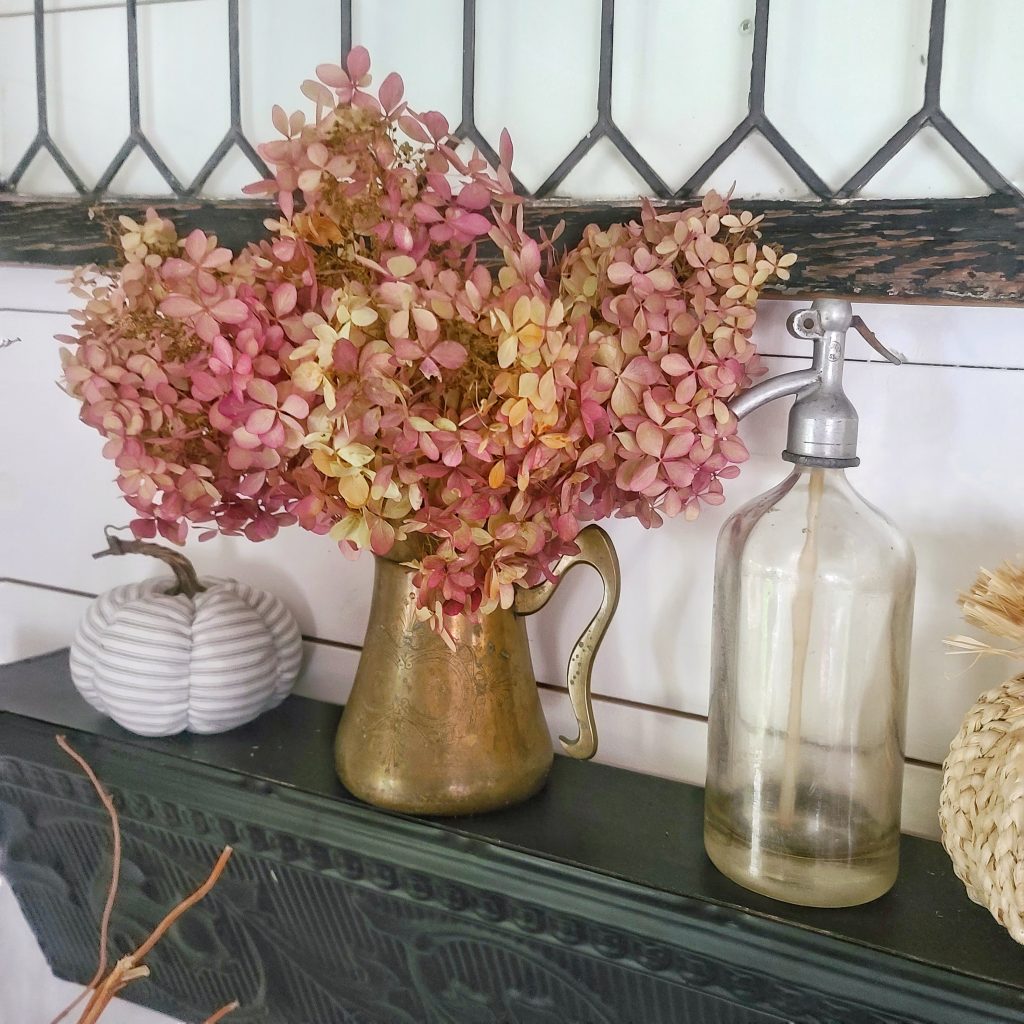 vintage copper pitcher with dried hydrangeas and fall decor