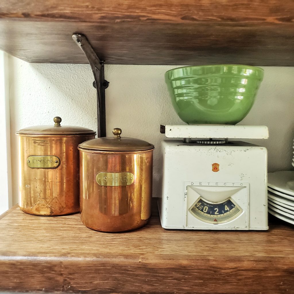 vintage copper canisters and white vintage scale