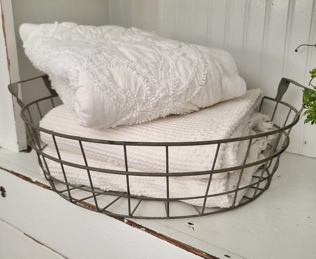 metal basket with pillow cases