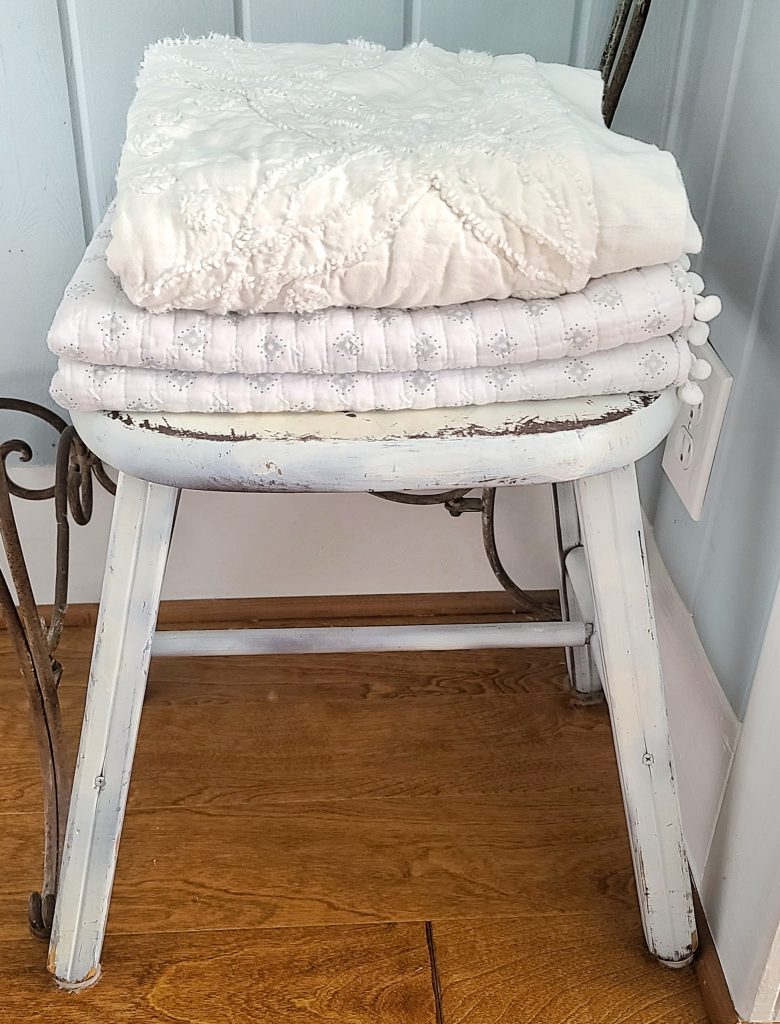 vintage wooden stool and pillowcases