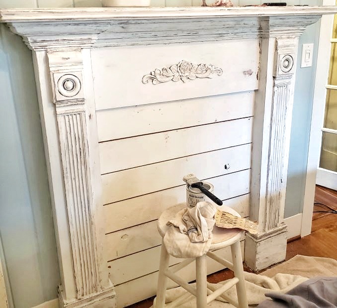faux fireplace mantle with chippy paint finish