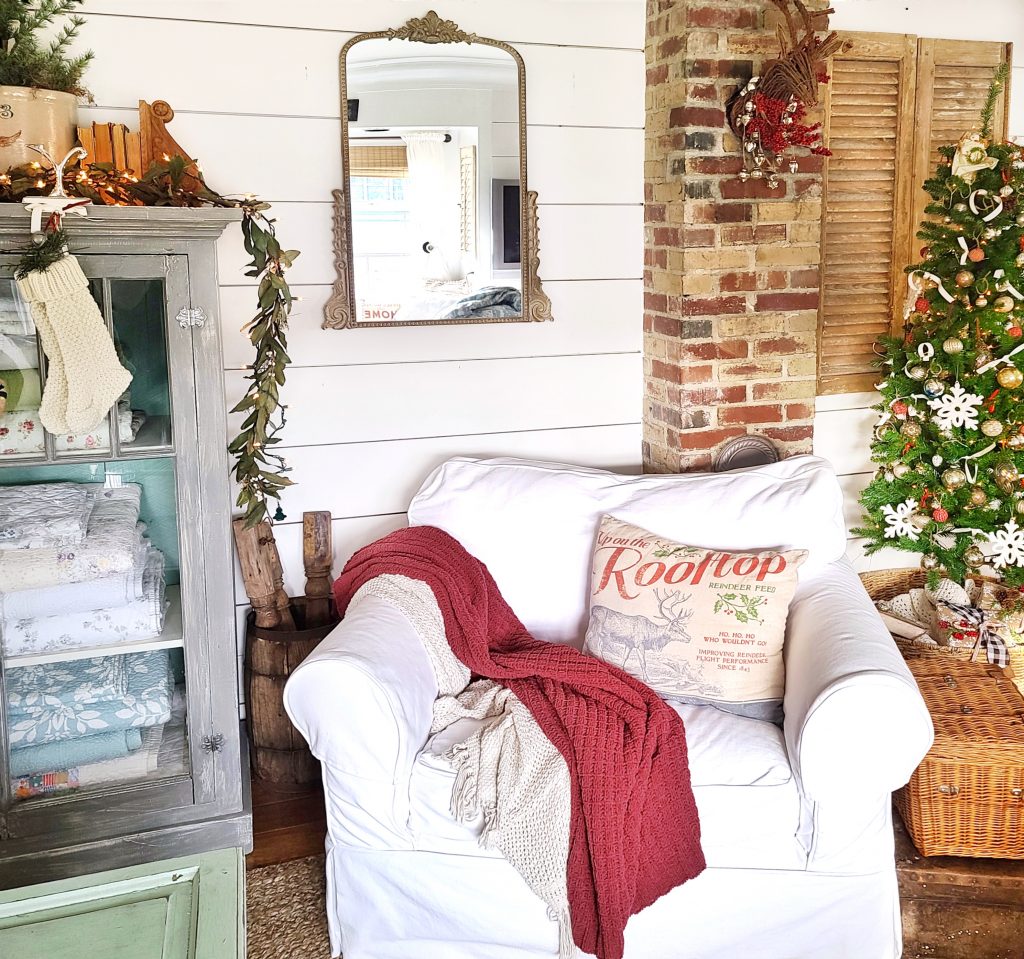cottage Christmas living room with white slipcovered chair