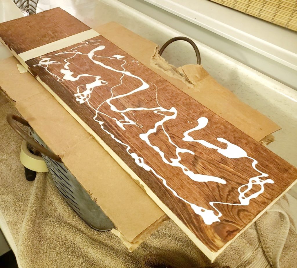Applying glue to a wood board