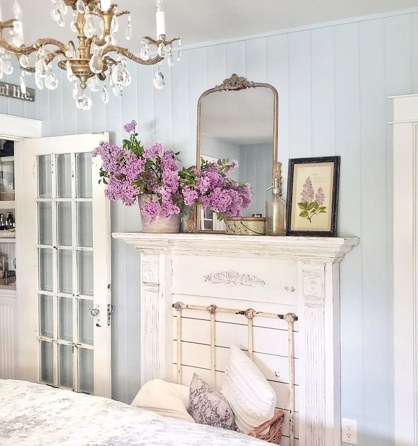 Top posts: Faux fireplace mantel surround with lilacs and mirror