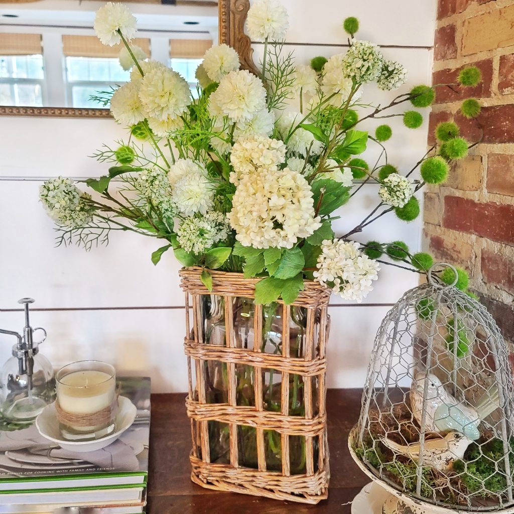 rattan vase with white faux flowers