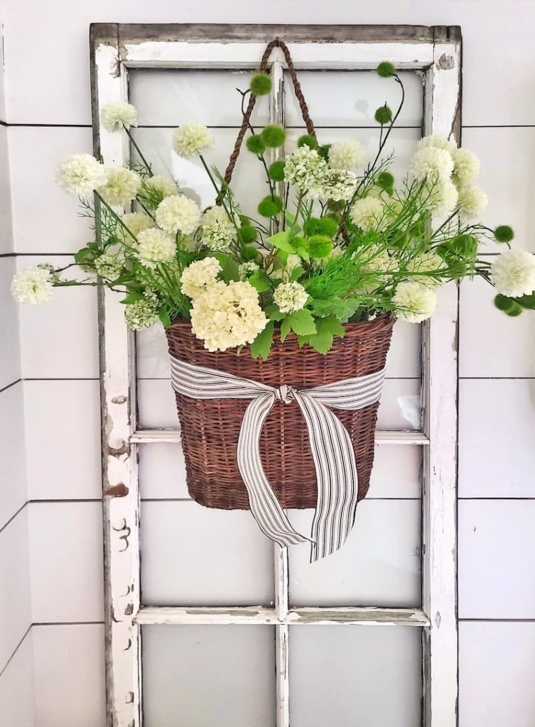 vintage window with hanging basket of faux flowers