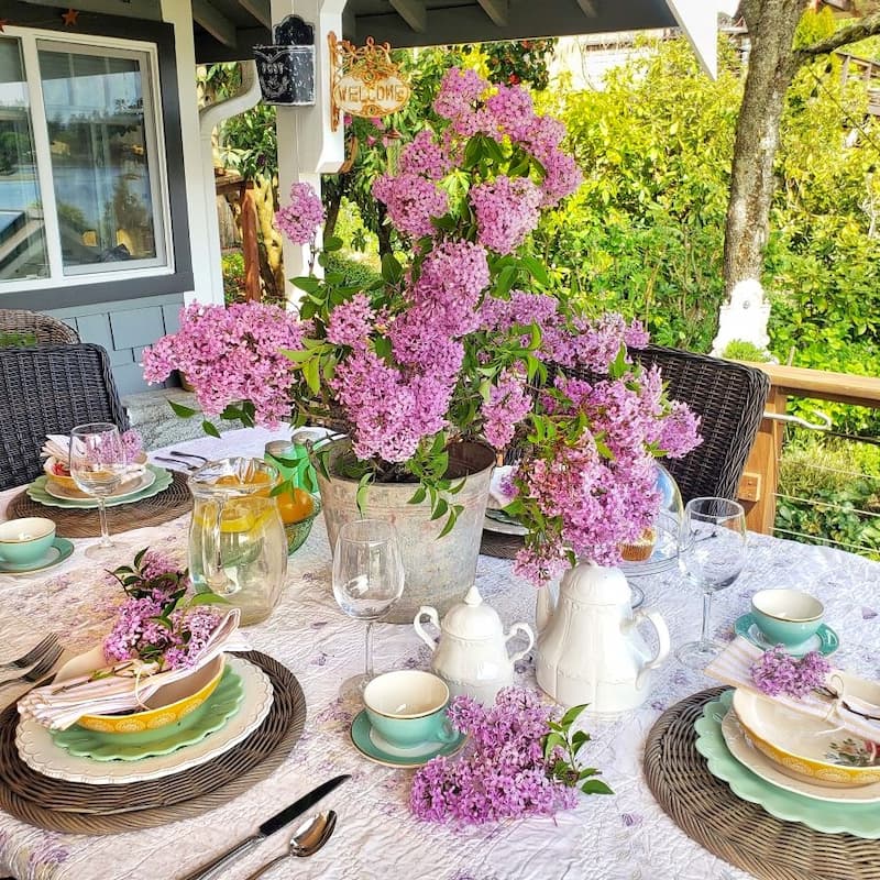 I used a vintage quilt as the tablecloth and vintage china for our Mother's Day tablescape last year.