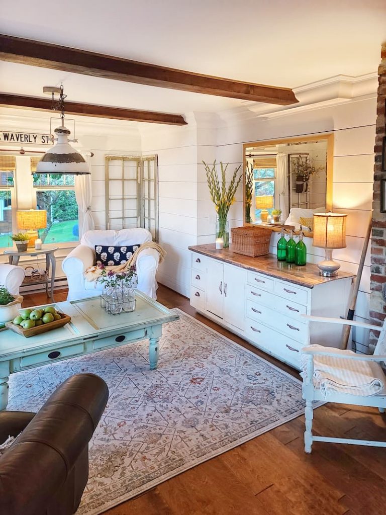 cottage style living room with vintage cabinet for storage
