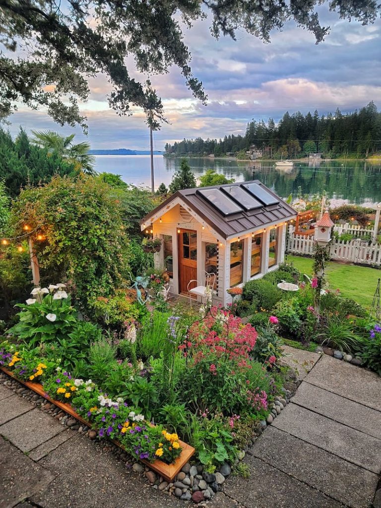 June garden and greenhouse overlooking the Puget Sound