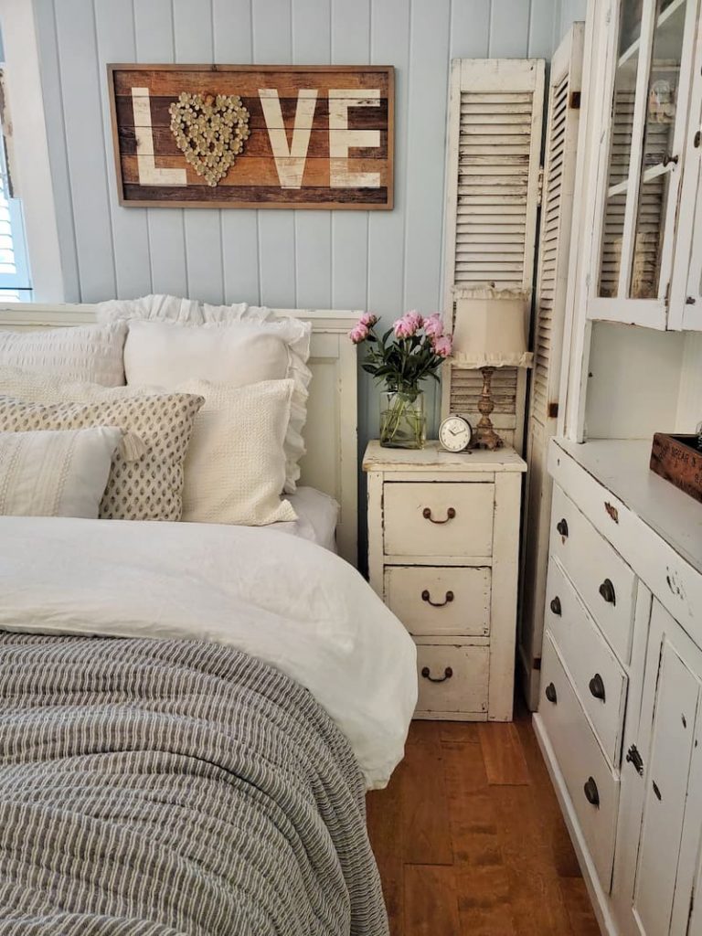 cottage bedroom with chippy vintage furniture