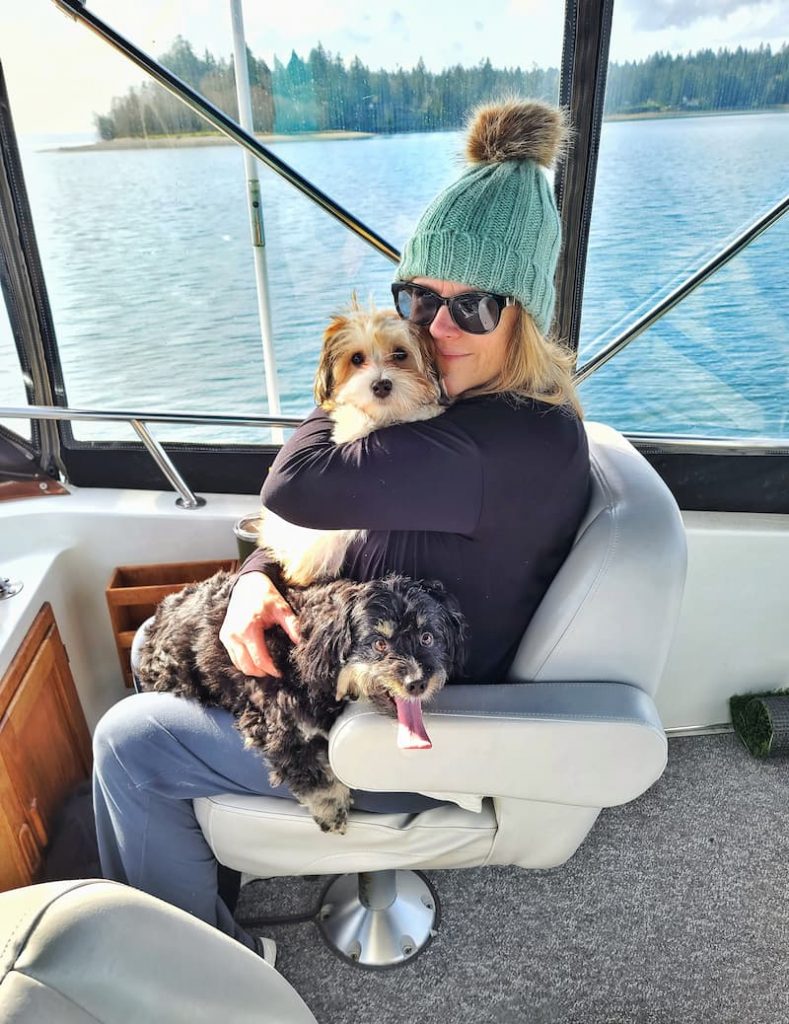 Meet Kim with the dogs on the boat