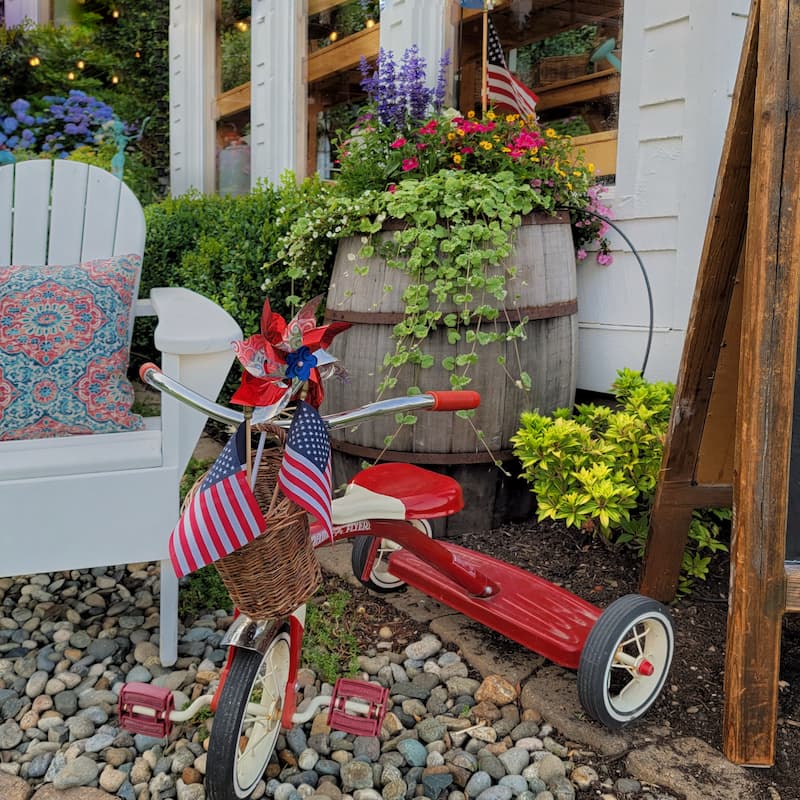 red vintage tricycle with patriotic decor