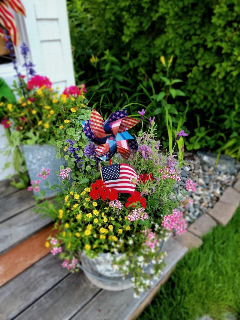 pinwheels and mini American flags in the planters