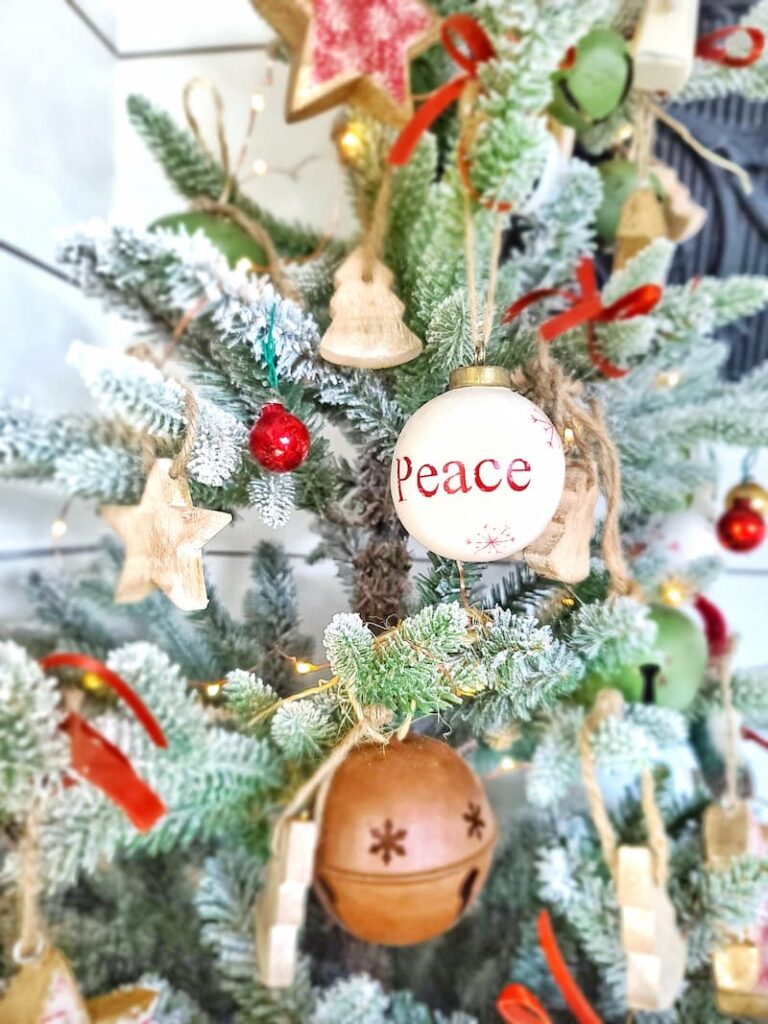 Peace Christmas ornament on the tree