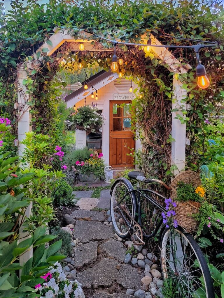 vintage garden decor: greenhouse pathway with vintage bike