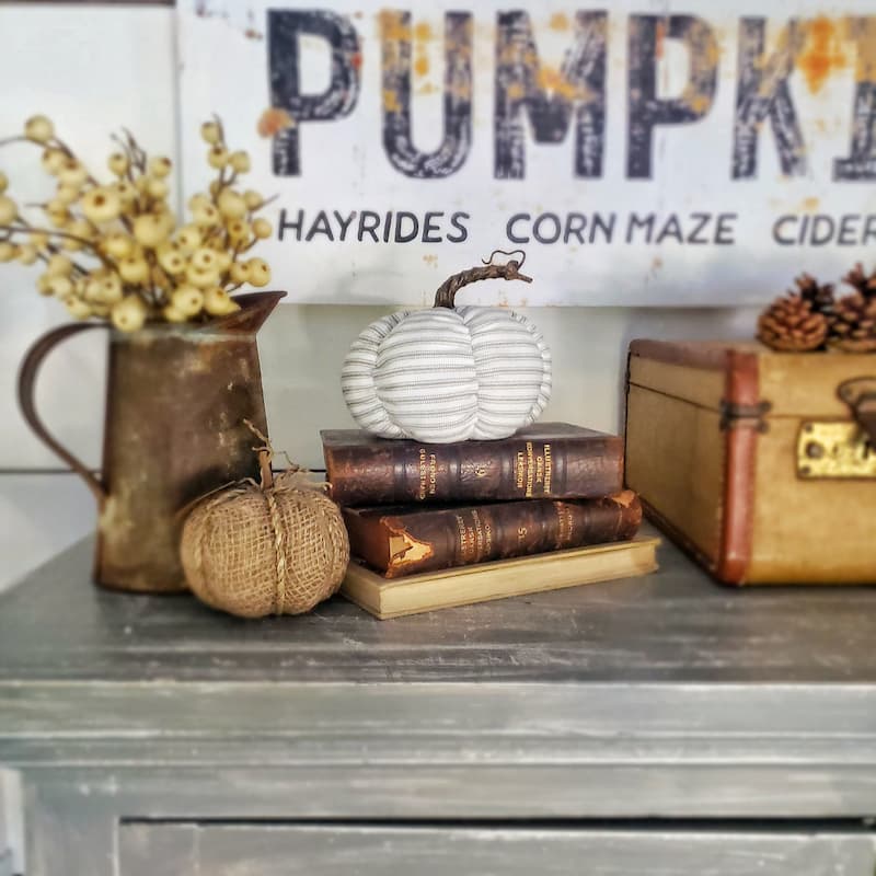 striped fabric pumpkin and vintage books