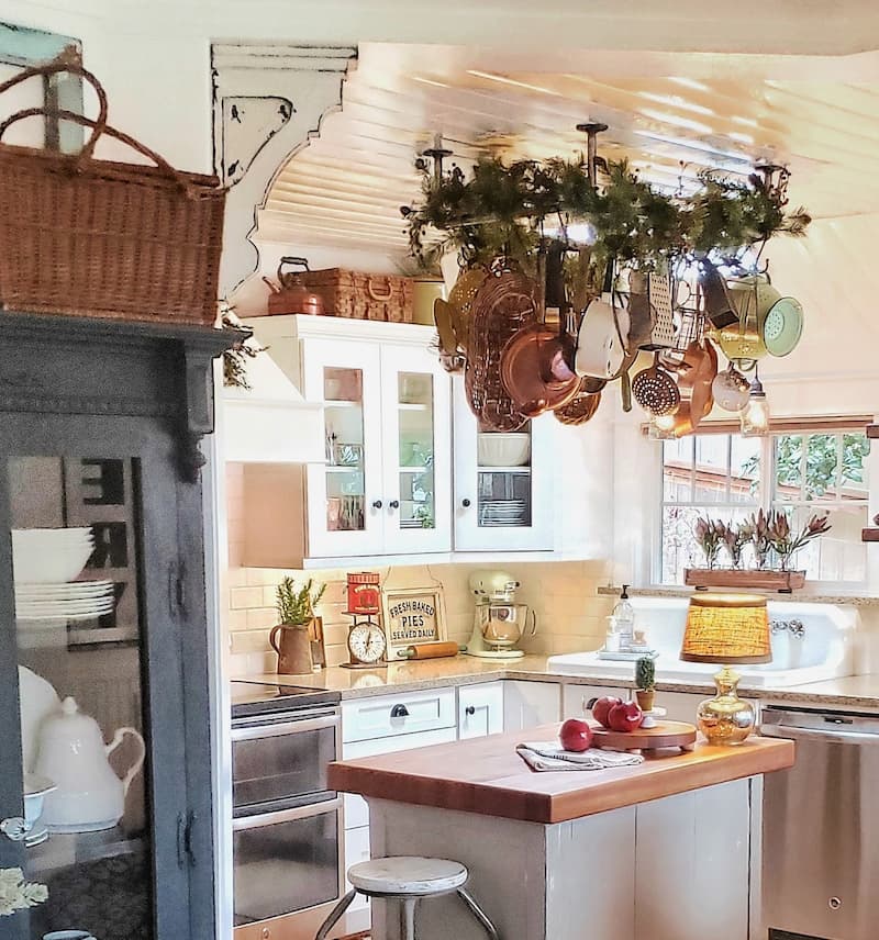 Christmas cottage kitchen with garland around pot rack