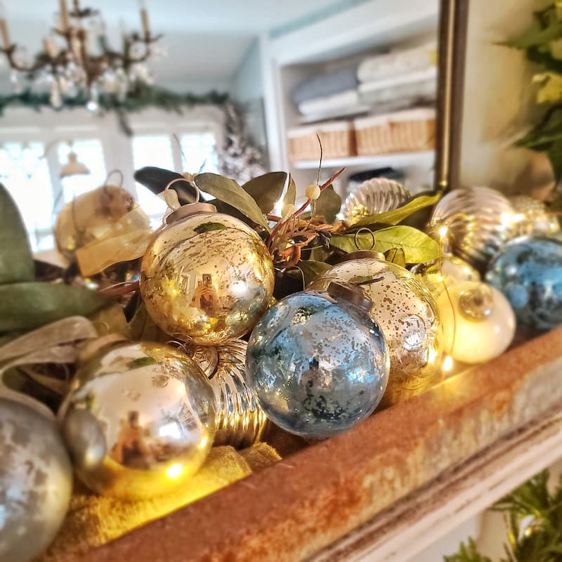 ornaments in a vintage chicken feeder