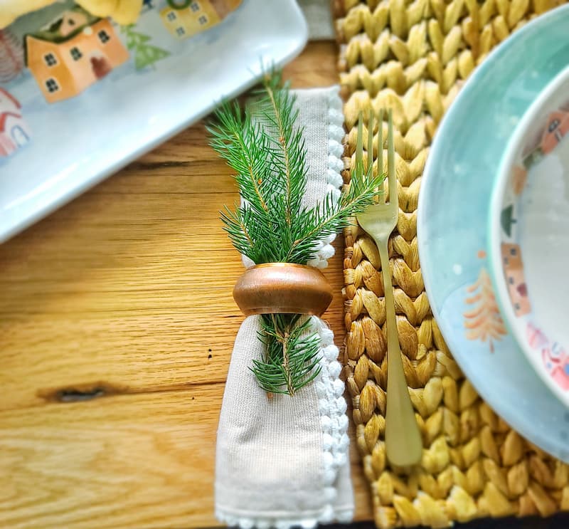 Christmas cottage tablescape napkin with greenery
