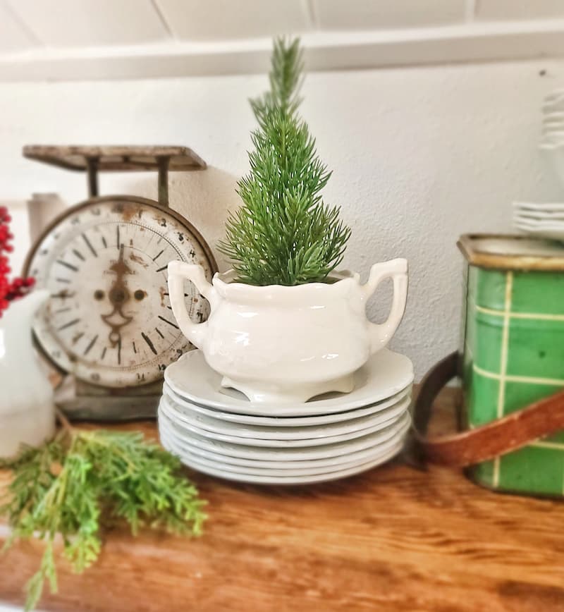 faux mini Christmas tree in ironstone bowl