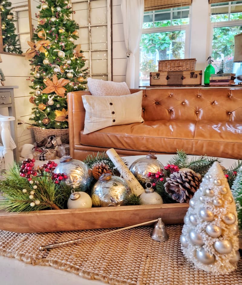 Christmas decor theme: dough bowl filled with greenery, ornaments and pinecones