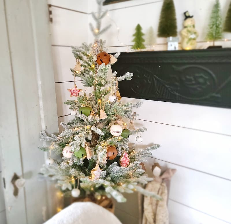 Winter holiday decorating: Small Christmas tree with ornaments
