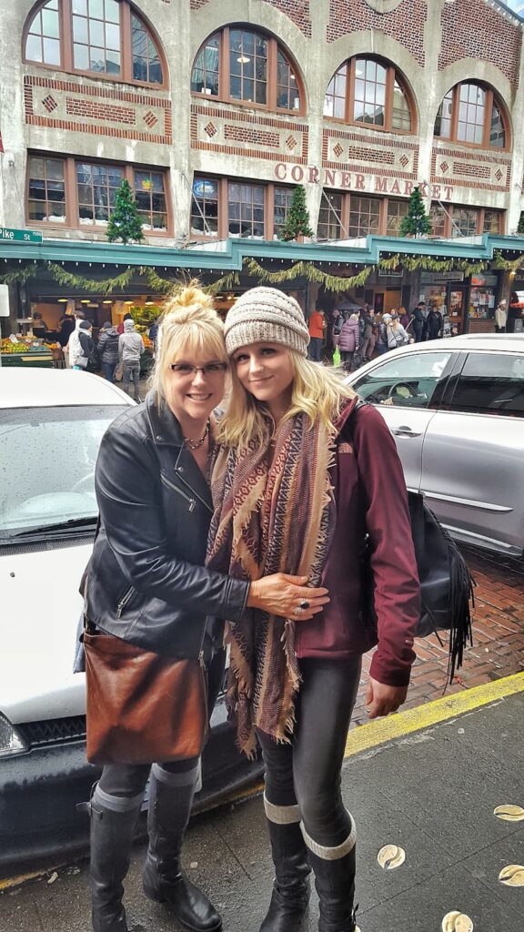 my daughter and I at Pike Place Market in Seattle at Christmas time
