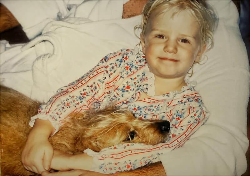 child with dog at Christmas