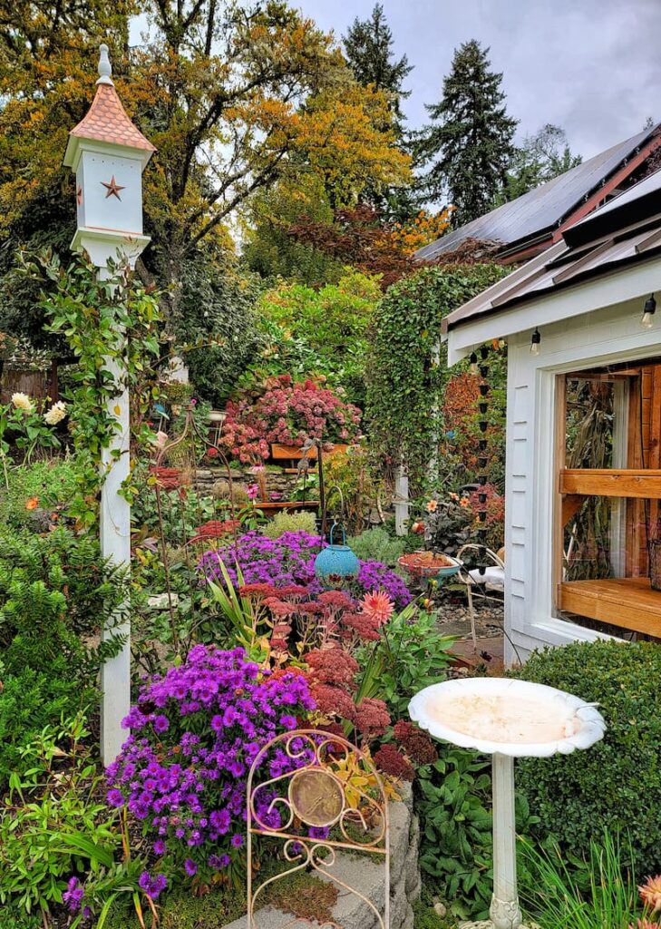 fall cottage garden and bird house