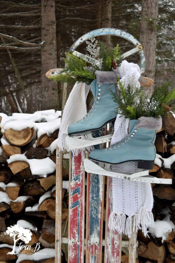 vintage sled with turquoise skates and white scarf