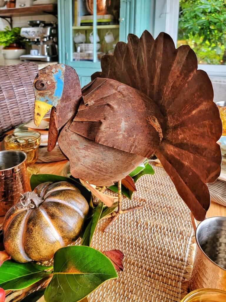 metal turkey centerpiece on Thanksgiving table
