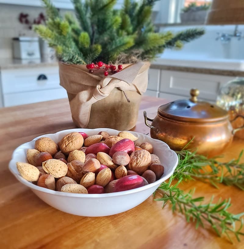 bowl of nuts and Christmas tree