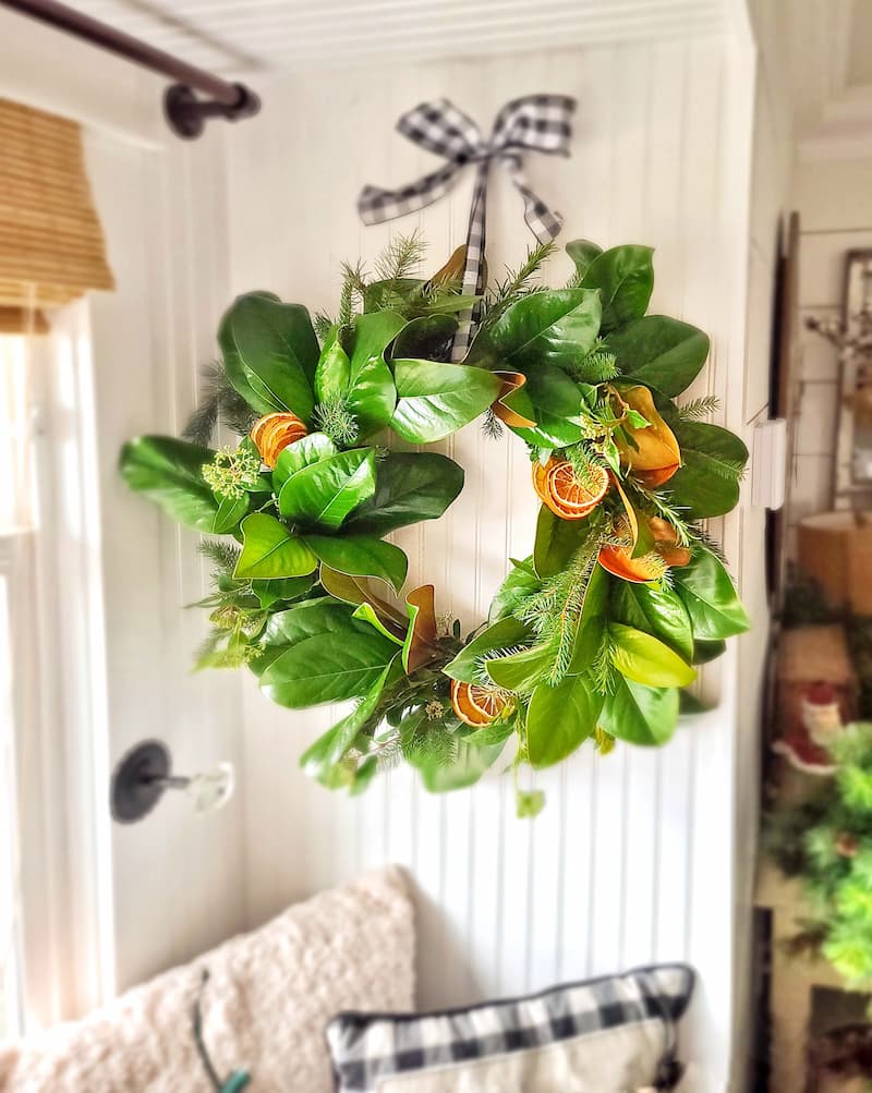 Christmas natural elements:  fresh magnolia leave wreath and dried orange slices