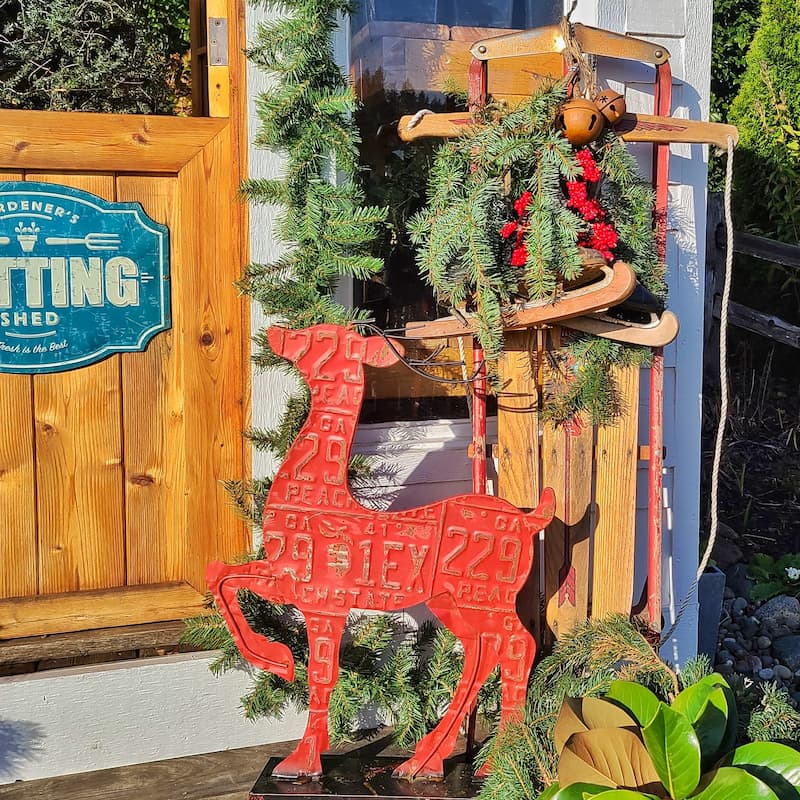 red reindeer and vintage sleigh