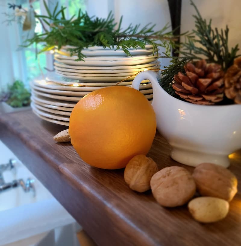 orange and nuts with white plates