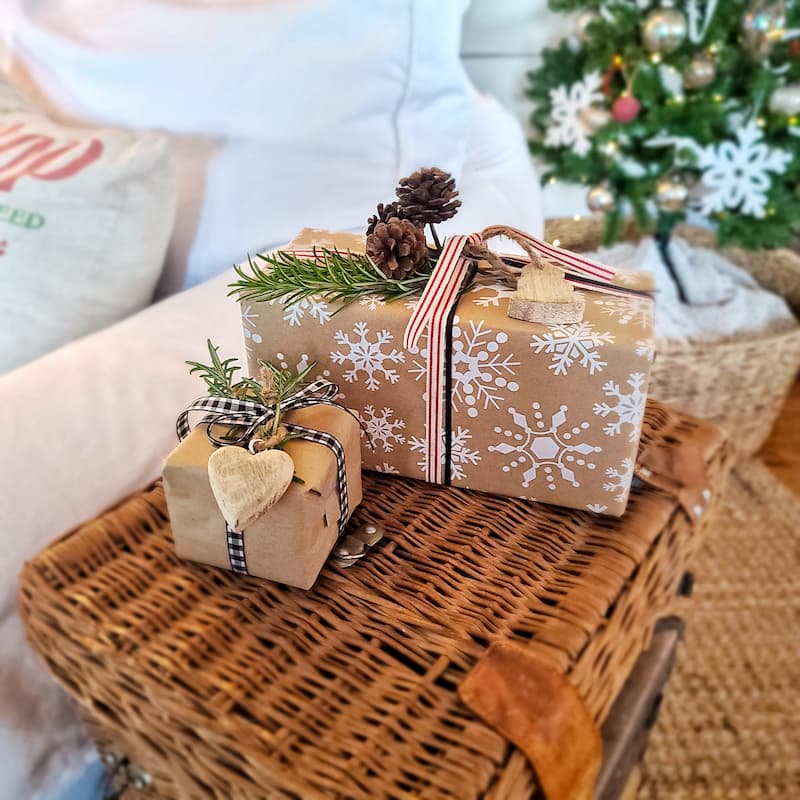 wrapped gifts on wicker trunk