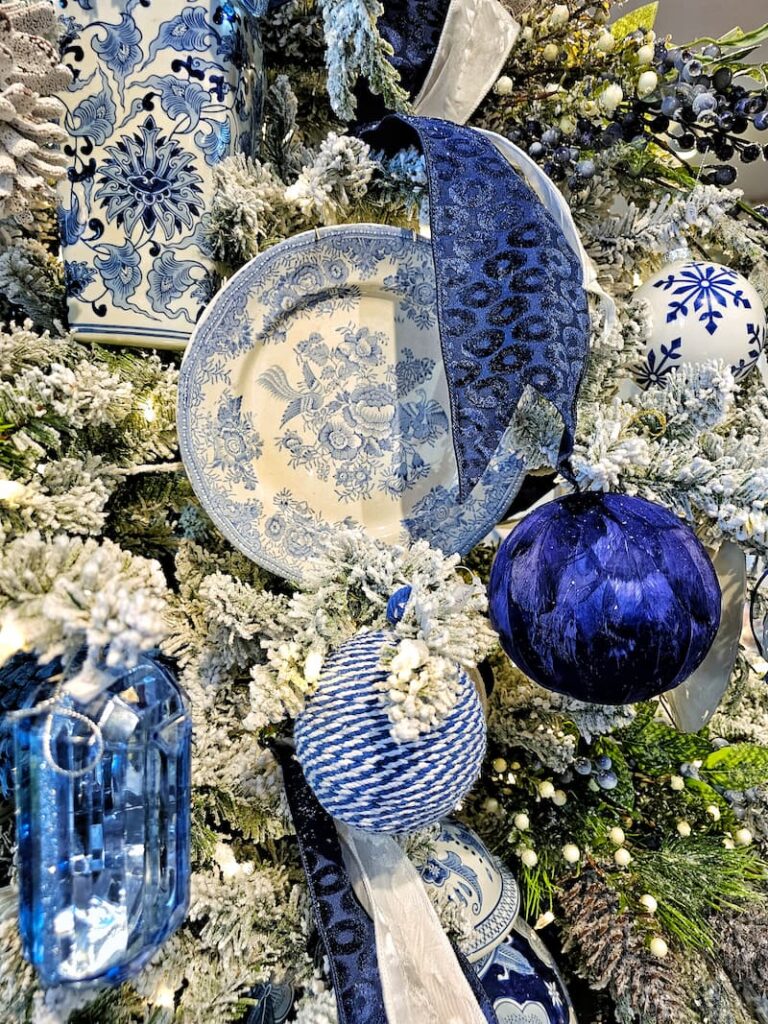 blue and white patterned dishware and other ornaments on a Christmas tree