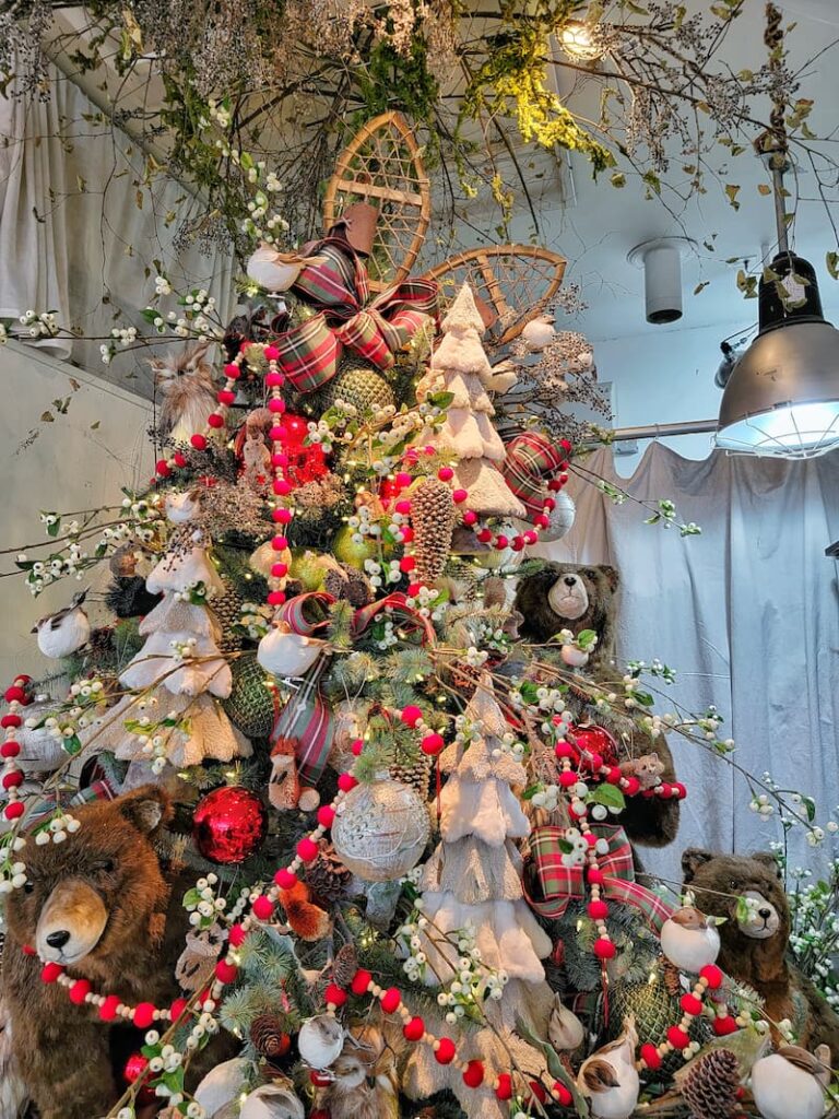 Woodland Christmas decor themed tree with beards, pinecones and other rustic ornaments