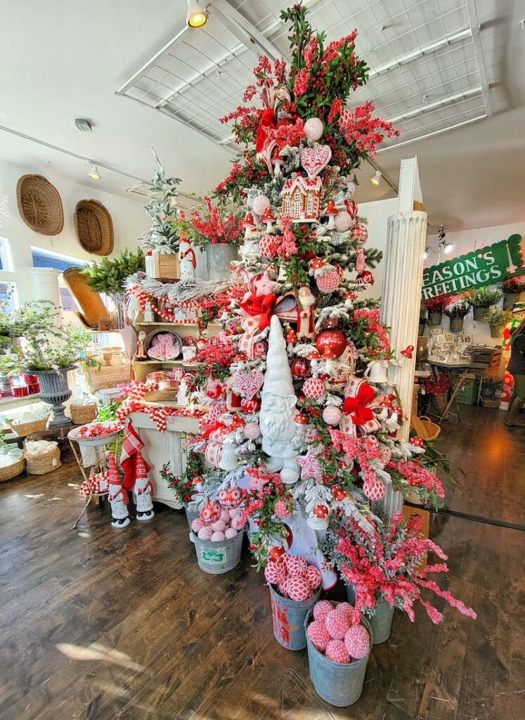 red and white Christmas tree and decorations in store