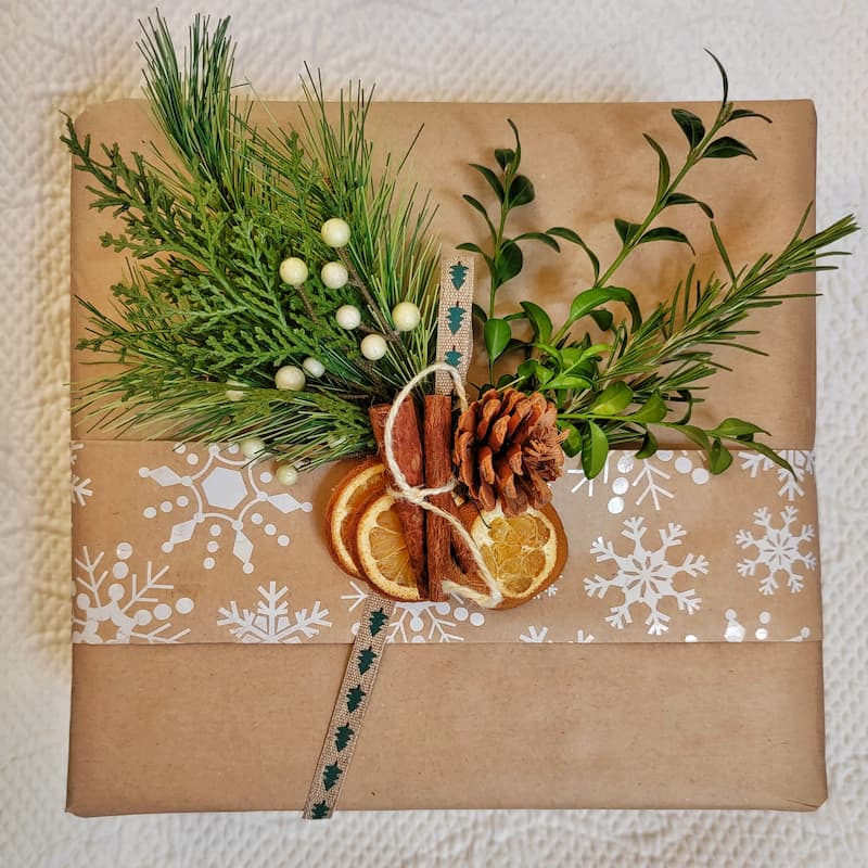 with greenery, pinecones and dried oranges