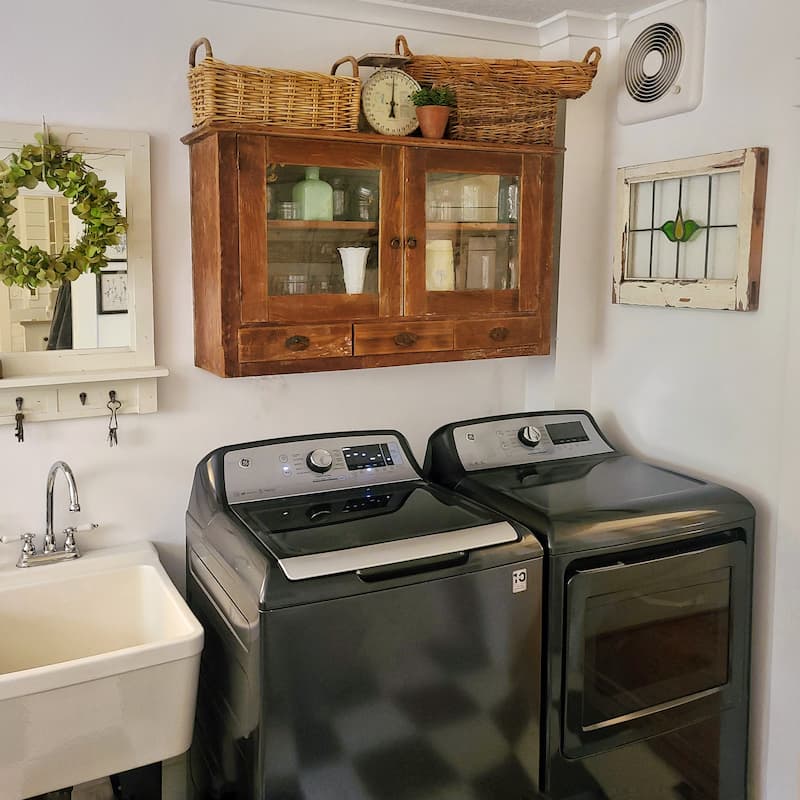 wooden cabinet and washer and dryer