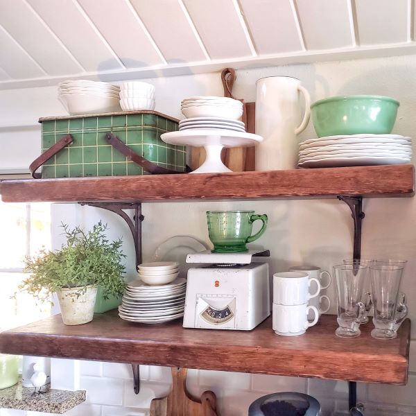 open shelving with greens