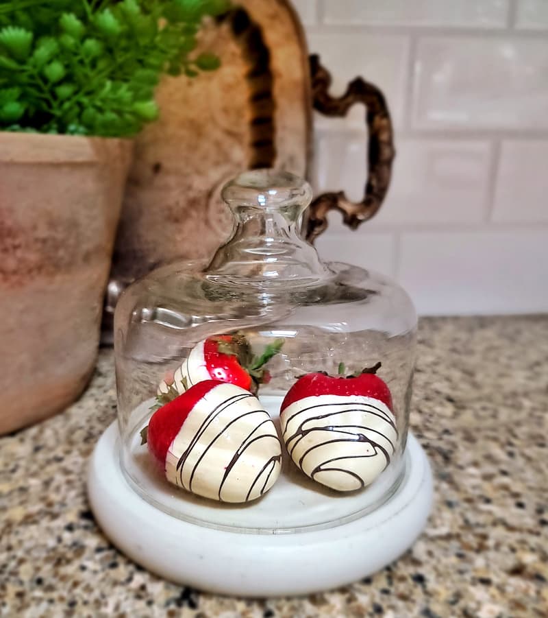 glass cloche with white chocolate covered strawberries